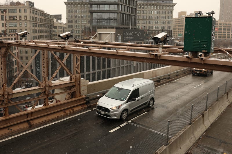 Cameras are seen on the Brooklyn Bridge as cars drive into Manhattan on January 6, 2025