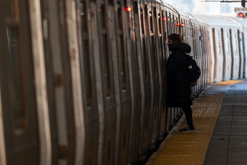 A subway rider boards a train at a Brooklyn station after a series of high-profile violent crimes on the transit system on Jan. 8, 2025 in New York City.