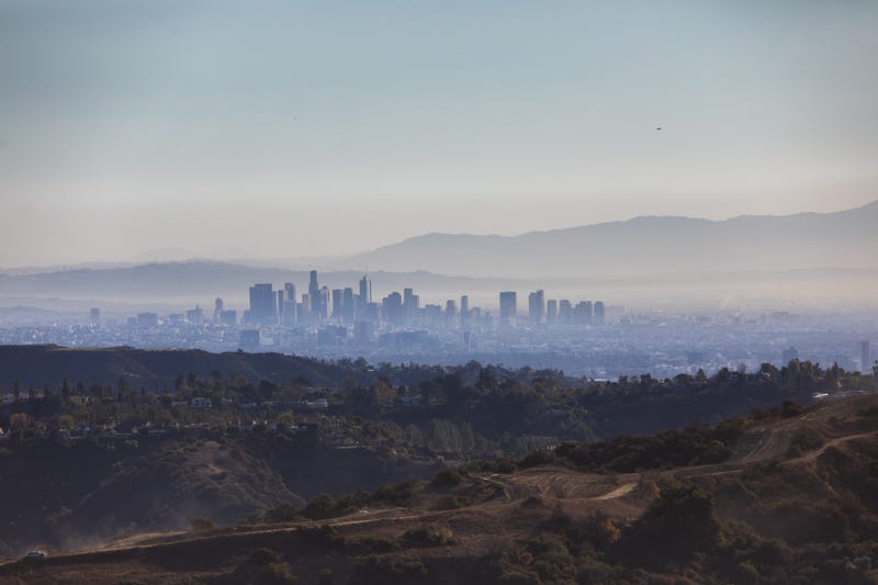 Wildfire smoke covers downtown Los Angeles seen from Encino Hill on Jan. 12, 2025, in the Encino neighborhood of Los Angeles, California.
