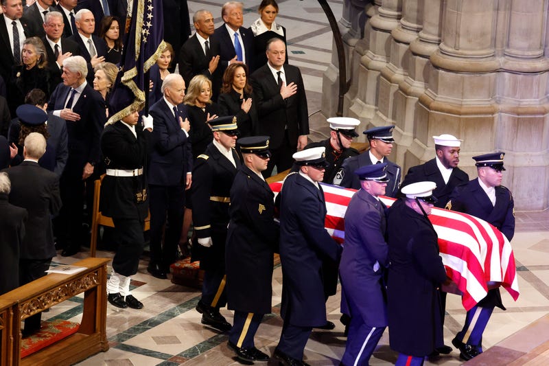U.S. Military Body Bearers carry the flag-draped casket bearing the remains of former President Jimmy Carter into the Washington National Cathedral for his state funeral on January 9, 2025