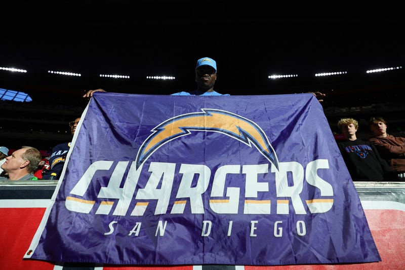  A Los Angeles Chargers fan poses for a picture during a game against the Houston Texans in the AFC Wild Card Playoffs at NRG Stadium on January 11, 2025 in Houston, Texas.
