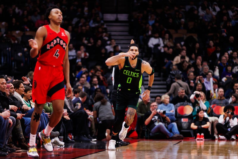 Jayson Tatum #0 of the Boston Celtics celebrates a basket against Scottie Barnes #4 of the Toronto Raptors during second half of their NBA game at Scotiabank Arena on January 15, 2025 in Toronto, Canada.