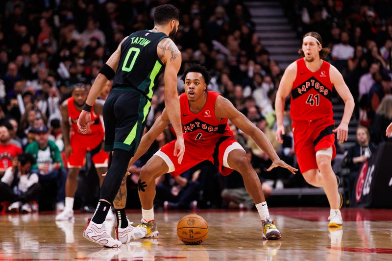 Scottie Barnes #4 of the Toronto Raptors defends against Jayson Tatum #0 of the Boston Celtics during second half of their NBA game at Scotiabank Arena on January 15, 2025 in Toronto, Canada.