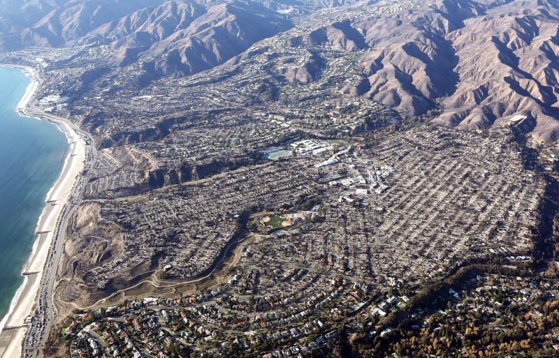 An aerial view of homes destroyed in the Palisades Fire as wildfires cause damage and loss through the LA region on January 13, 2025 in Pacific Palisades, California.
