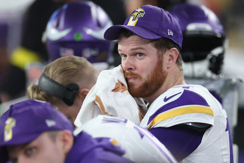 Sam Darnold #14 of the Minnesota Vikings reacts on the bench during the NFL playoff game at State Farm Stadium on January 13, 2025 in Glendale, Arizona. The Rams defeated the Vikings 27-9 