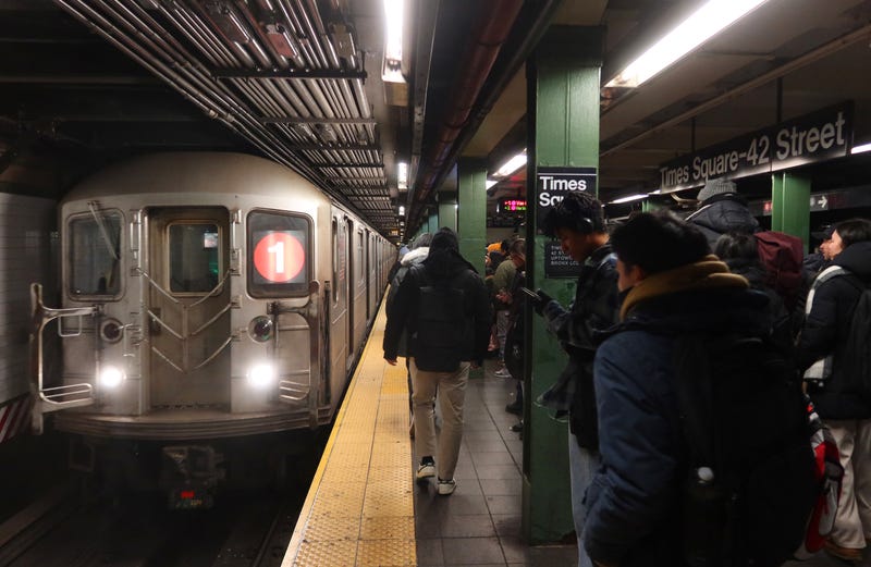 People wait on the platform to board a 1-line train at the Times Square–42nd Street subway station on January 15, 2025