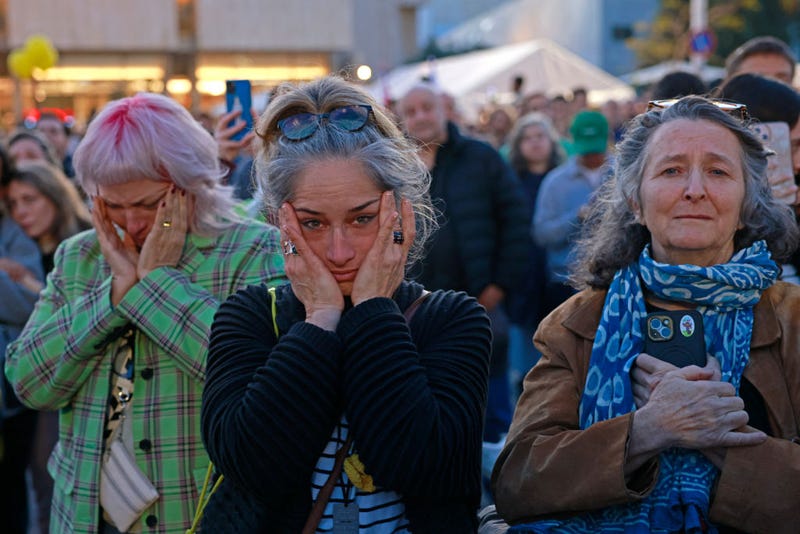 Supporters and relatives of hostages held captive in the Gaza Strip since the Oct. 7, 2023 attacks by Hamas react while watching a live television broadcast on the release of Israeli hostages, at the Hostages Square in Tel Aviv, on Jan. 19 2025.