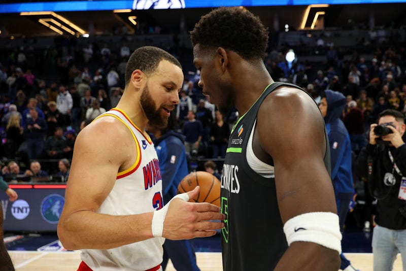 Stephen Curry #30 of the Golden State Warriors and Anthony Edwards #5 of the Minnesota Timberwolves shake hands after the game at Target Center on January 15, 2025 in Minneapolis, Minnesota. The Warriors defeated the Timberwolves 116-115.
