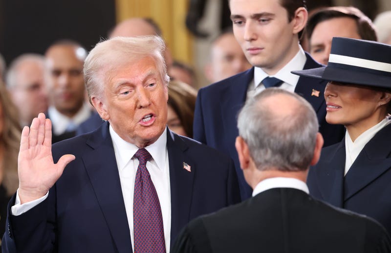 U.S. President-elect Donald Trump takes the oath of office as Barron Trump and Melania Trump look on during inauguration ceremonies in the U.S. Capitol Rotunda on January 20, 2025 in Washington, DC. Donald Trump takes office for his second term as the 47th president of the United States. (Photo by Kevin Lamarque - Pool/Getty Images)