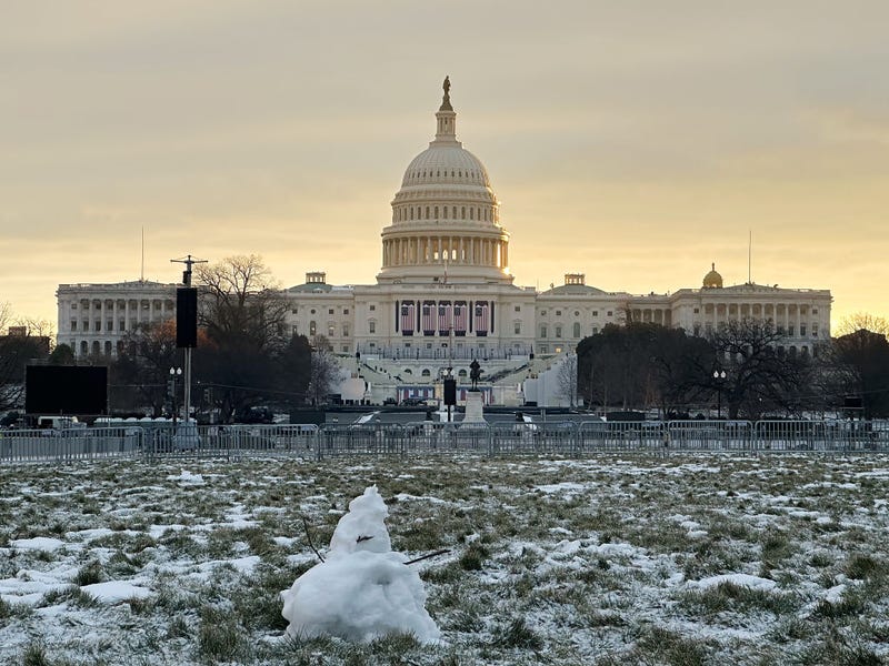 Remnants of a small snowman stand on the National Mall in front of the U.S. Capitol in the days ahead of President-elect Donald Trump's second-term inauguration. The ceremony on Jan. 20 will be moved to the rotunda of the U.S. Capitol as temperatures are expected to be the lowest in 40 years.
