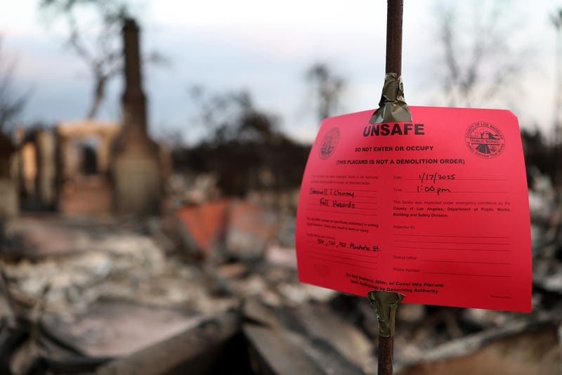 ALTADENA, CALIFORNIA - JANUARY 17: An 'Unsafe' red tag noticed is posted at a home which burned in the Eaton Fire on January 17, 2025 in Altadena, California. Multiple wildfires which were fueled by intense Santa Ana Winds have burned across Los Angeles County leaving at least 27 dead with over 180,000 people having been under evacuation orders. Over 12,000 structures have been burned in the Palisades and Eaton Fires.