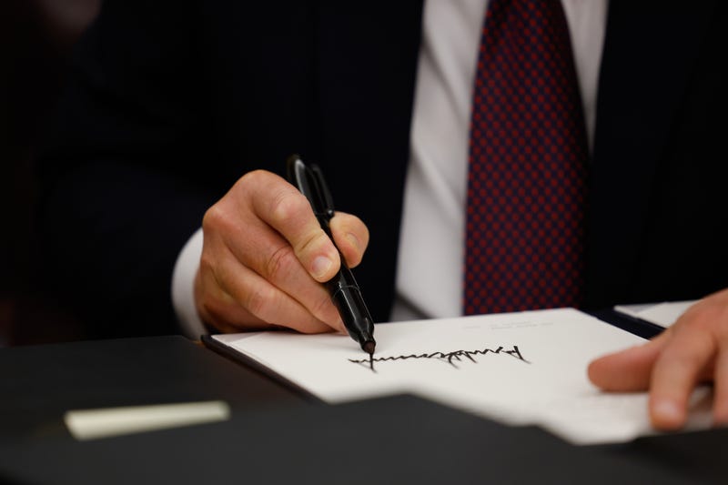 President Donald Trump signs executive orders in the Oval Office on January 20, 2025 in Washington, DC. Trump takes office for his second term as the 47th president of the United States.