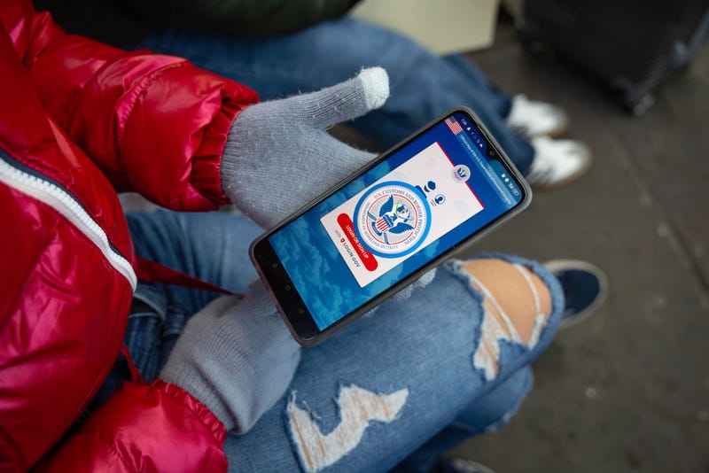 An immigrant from Venezuela tries in vain to access the CBP One app day a day after the second inauguration of U.S. President Donald Trump on January 21, 2025 in Nogales, Mexico.
