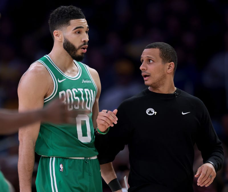 Joe Mazzulla of the Boston Celtics speaks with Jayson Tatum #0 after a timrout during a 117-96 loss to the Los Angeles Lakers at Crypto.com Arena on January 23, 2025 in Los Angeles, California.