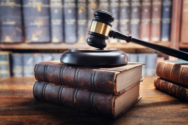 Gavel rests on legal books
