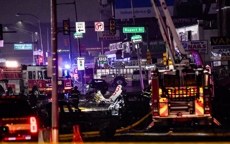 Emergency response crews on Cottman Avenue investigate the wreckage of the medical jet crash on Jan. 31, 2025.