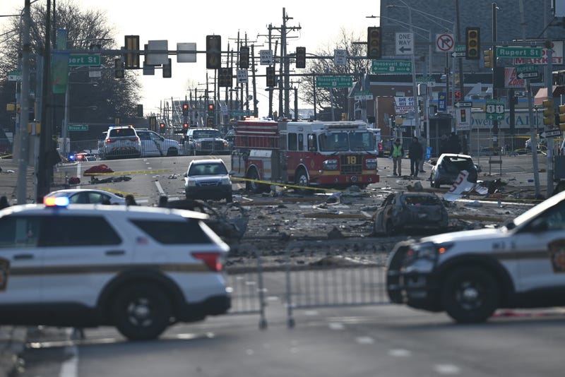 FBI Evidence Response Team, ATF, NTSB, FAA, Philadelphia Police Crime Scene Unit and other investigators on the scene of a plane crash in Northeast Philadelphia on Saturday.