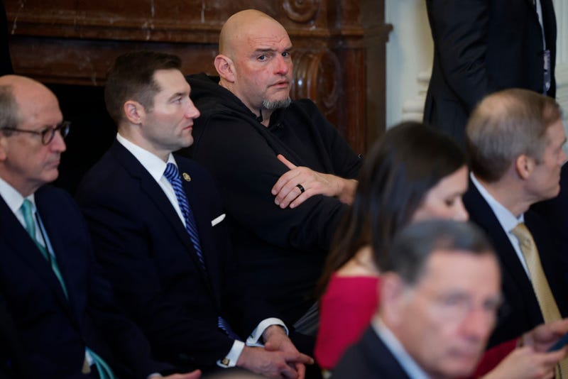 Sen. John Fetterman (D-PA) (C) joins other lawmakers for the signing ceremony for the Laken Riley Act