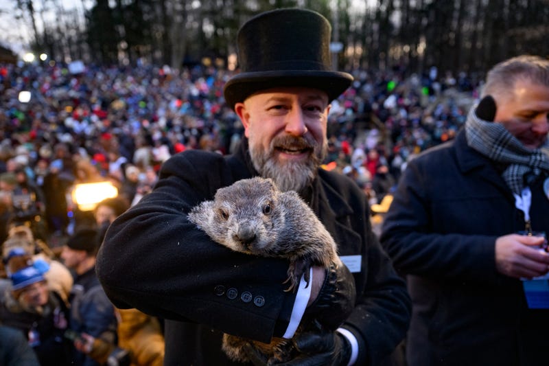 Groundhog handler AJ Dereume holds Punxsutawney Phil after he saw his shadow predicting six more weeks of winter during the 139th annual Groundhog Day festivities on Friday February 2, 2025 in Punxsutawney, Pennsylvania.
