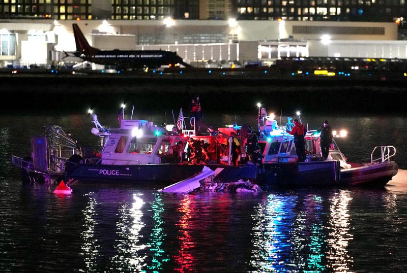 Rescue boats search the Potomac River after plane crash