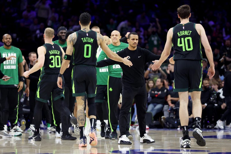 Boston Celtics head coach Joe Mazzulla high fives Jayson Tatum #0 and Luke Kornet #40 during the second half against the Philadelphia 76ers at the Wells Fargo Center on February 02, 2025 in Philadelphia, Pennsylvania