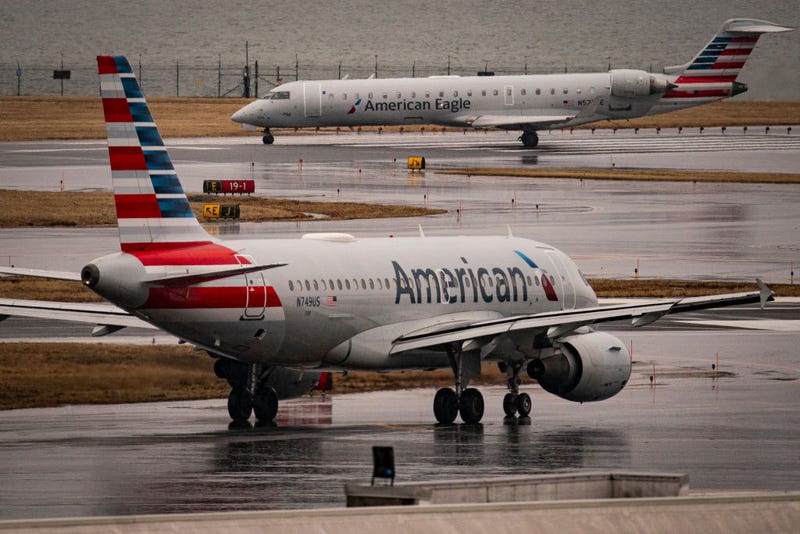 An American Eagle and American Airlines plane taxi on the runway at Ronald Reagan National Airport, on Feb. 6, 2025 in Arlington, Virginia