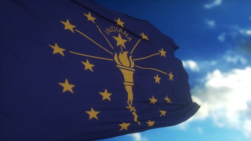 Indiana flag on a flagpole waving in the wind