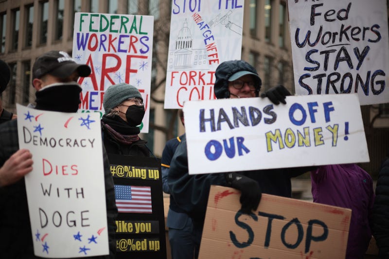 Protesters rally outside of the Theodore Roosevelt Federal Building headquarters of the U.S. Office of Personnel Management on February 05, 2025 in Washington, DC.