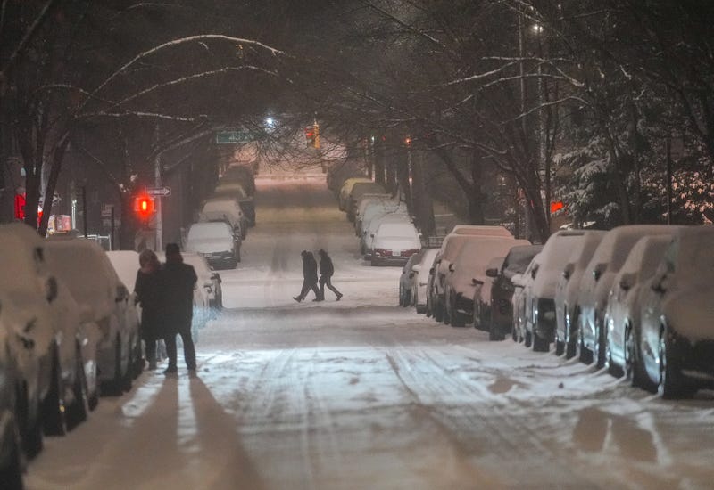 Snow-covered cars line the streets as a winter storm brings heavy snowfall to New York City on Feb. 8, 2025