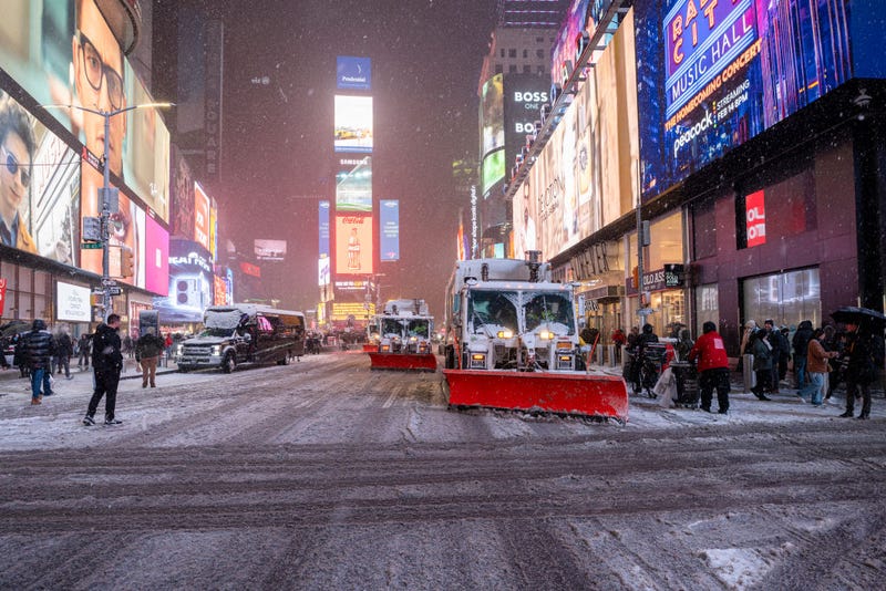 Trucks plow through the snow in Times Square on Feb. 8, 2025 in New York City.