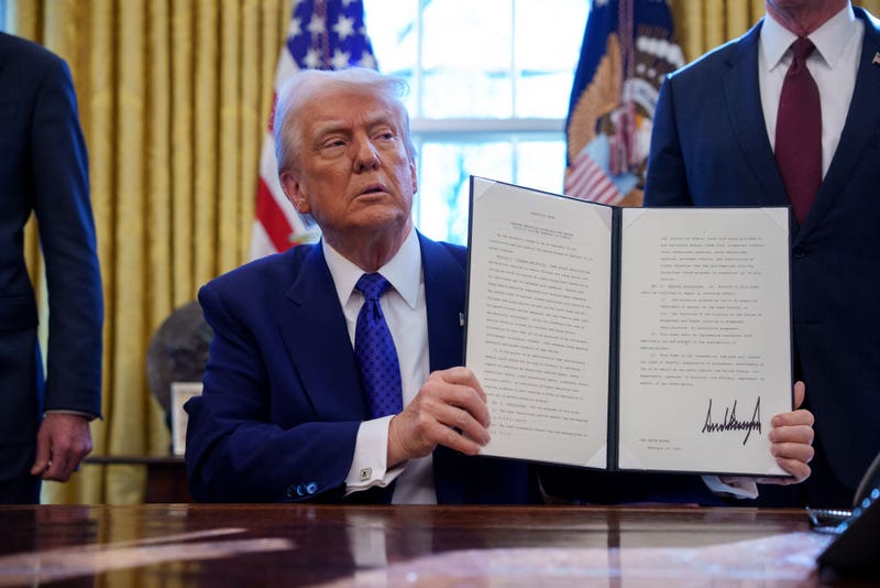 President Donald Trump signs an executive order Friday withholding federal funding from schools and universities that impose a COVID-19 vaccine mandate.