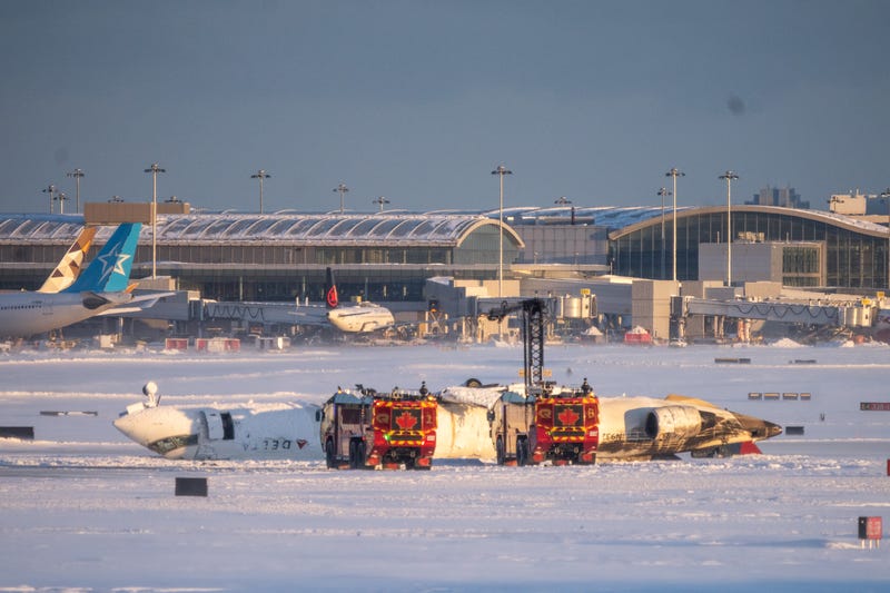 Emergency personnel work at the scene of a Delta Airlines plane crash at Toronto Pearson International Airport on Feb. 17, 2025, in Toronto, Canada.