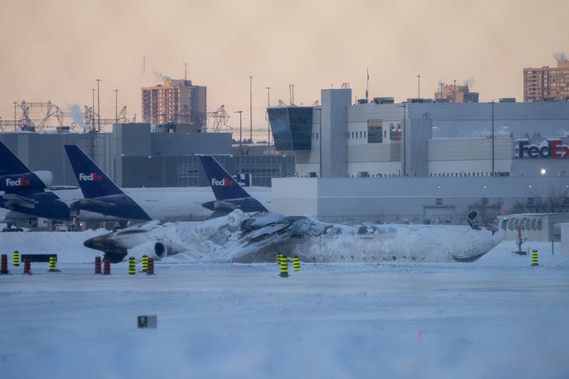 The site of the snow-covered Delta Airline plane crash at Toronto Pearson International Airport on February 18, 2025 in Toronto, Canada. The jet coming in from Minneapolis attempted to land amid strong winds and snow, leading to it crashing and flipping over on the tarmac the day before. 