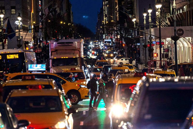 Traffic moves through Midtown Manhattan