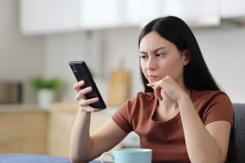 Person reading suspicious message