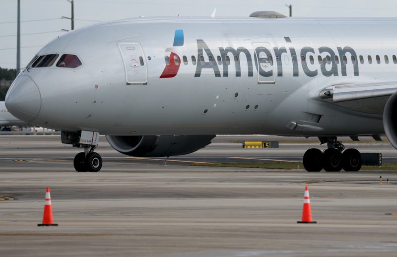 An American Airlines plane sits on the tarmac