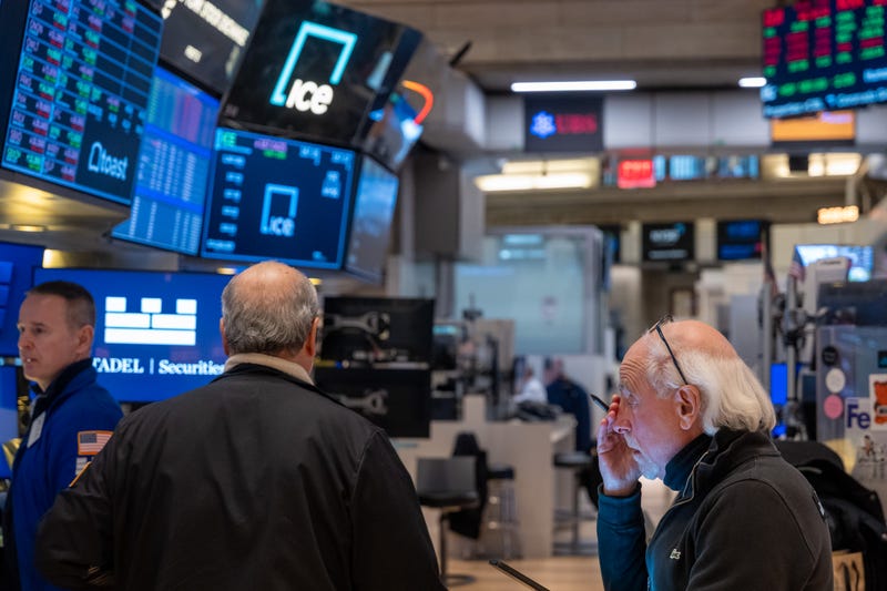 Traders work on the New York Stock Exchange