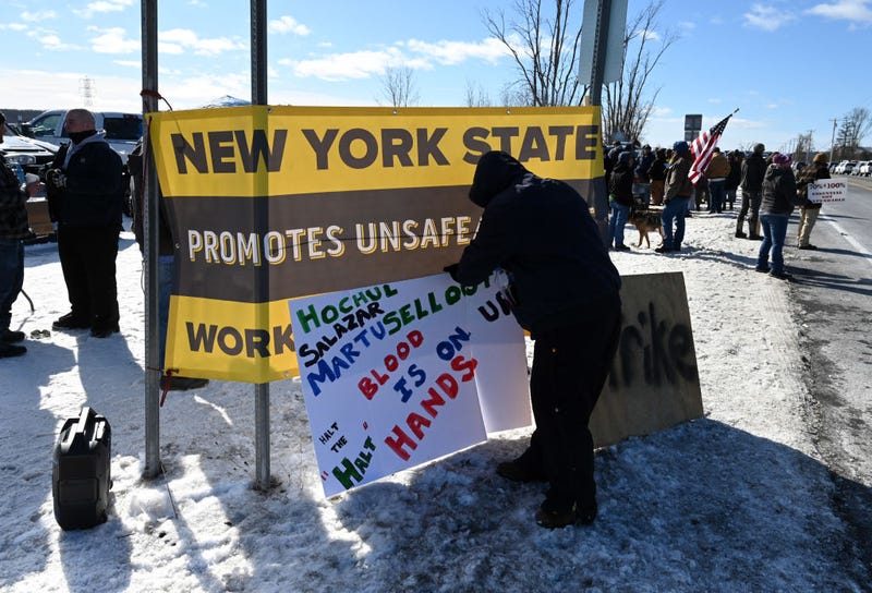 Striking correction officers and their supporters post signs along Route 9W during a protest near Greene Correctional Facility state prison Wednesday, Feb. 19, 2025, in Coxsackie, N.Y.
