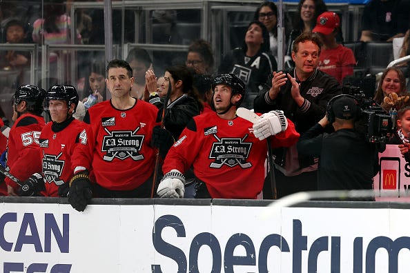 Head coaches Cobie Smulders and Vince Vaughn of Team Red celebrate after a goal against Team Black during the Skate For LA Strong event at Crypto.com Arena on February 23, 2025 in Los Angeles, California. 