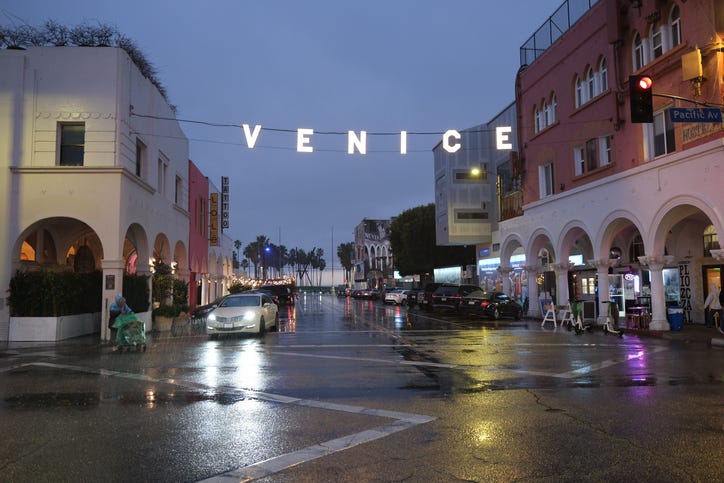This image was taken in Venice Beach, California on January 26, 2025. It is titled Venice Sign in Rain and it was taken on a rainy night photo tour.