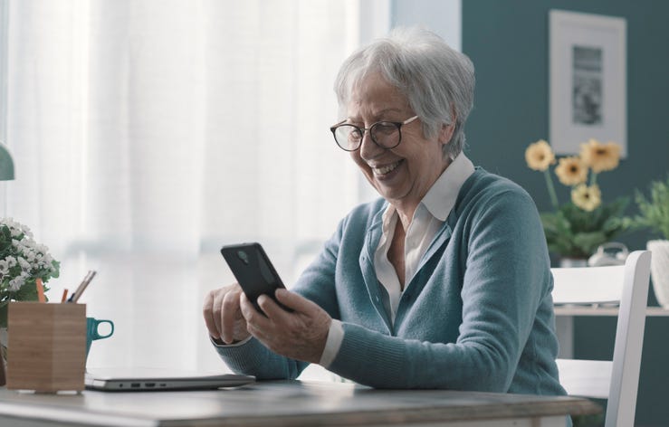 senior citizen on phone