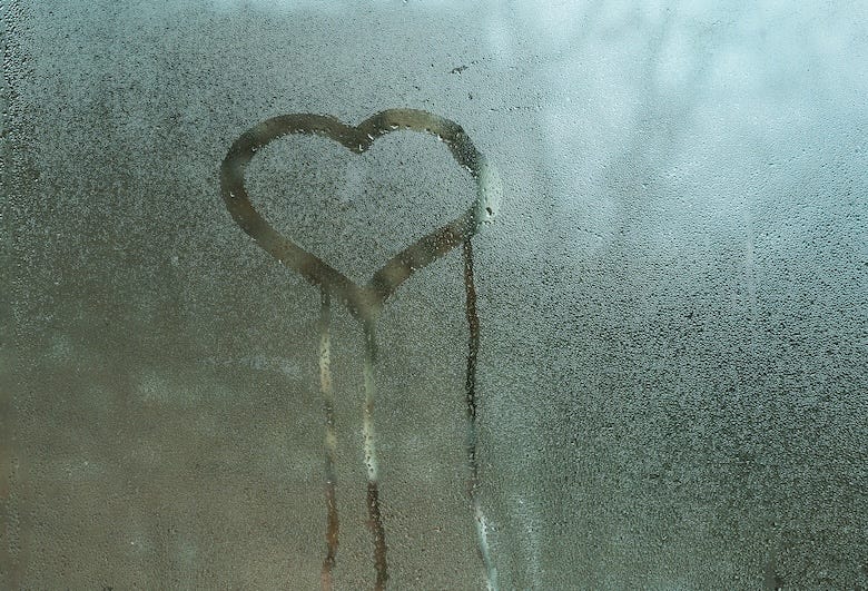 Heart drawn on condensation in window