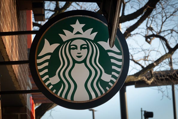  A sign hangs outside of a Starbucks coffeeshop on February 25, 2025 in Chicago, Illinoi