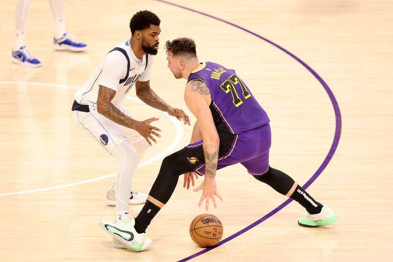 LOS ANGELES, CALIFORNIA - FEBRUARY 25: Naji Marshall #13 of the Dallas Mavericks defends against Luka Doncic #77 of the Los Angeles Lakers during the first half of a game at Crypto.com Arena on February 25, 2025 in Los Angeles, California. (Photo by Sean M. Haffey/Getty Images)