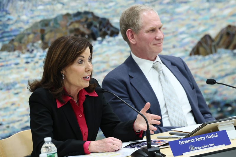 Gov. Kathy Hochul speaks as Janno Lieber, Chair & CEO at New York Metropolitan Transportation Authority, listens on during the MTA Board's monthly meeting at Grand Central Madison on February 26, 2025