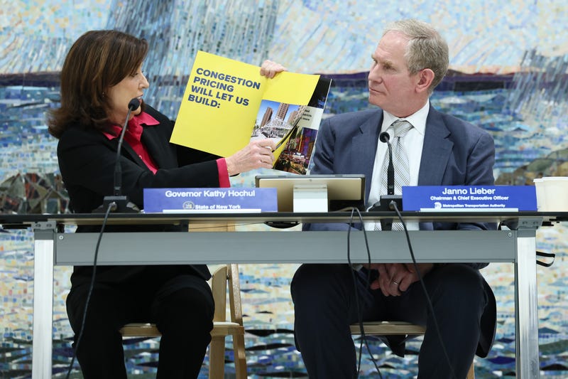 Gov. Kathy Hochul speaks as Janno Lieber, Chair & CEO at New York Metropolitan Transportation Authority, listens on during the MTA Board's monthly meeting at Grand Central Madison on February 26, 2025 in New York City. 