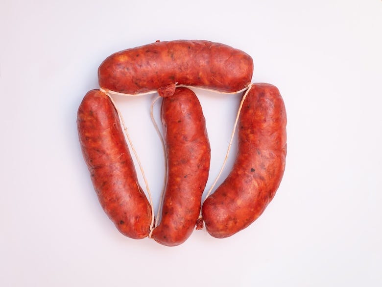 Spicy chorizo against a white background