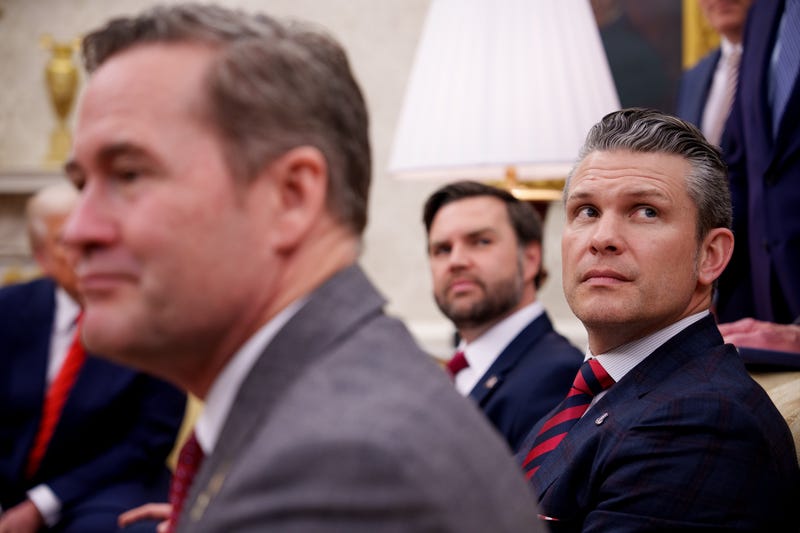 U.S. National Security Adviser Michael Waltz, U.S. Vice President J.D. Vance, and Defense Secretary Pete Hegseth, listen to a question from a reporter during a meeting in the Oval Office of the White House on March 13, 2025 in Washington, DC.