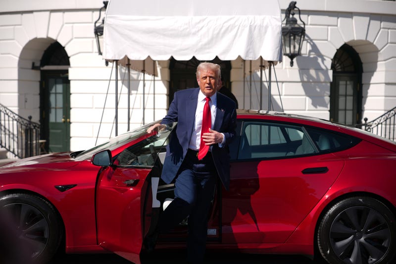 President Donald Trump gets out of a Tesla Model S on the South Lawn of the White House on March 11, 2025
