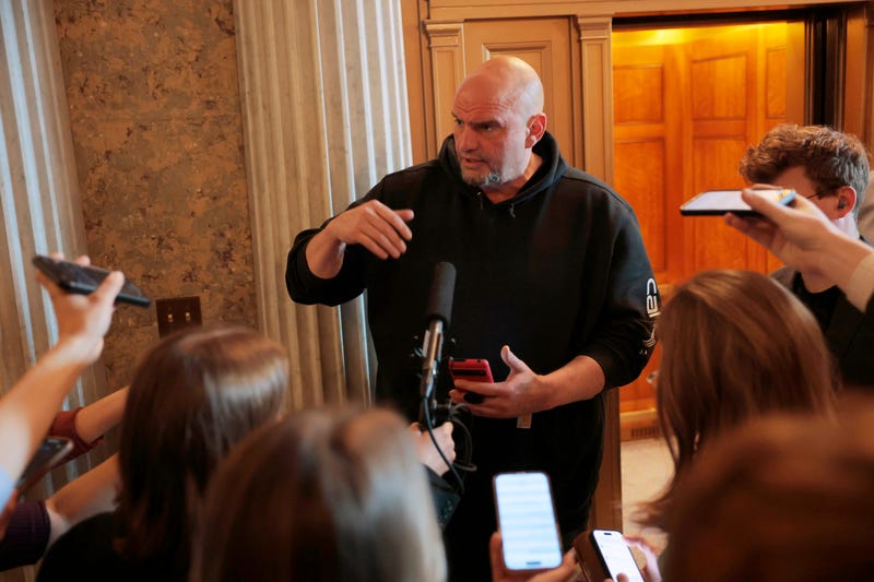 U.S. Sen. John Fetterman (D-PA) speaks to reporters outside of the Senate Chambers at the U.S. Capitol on March 13, 2025 in Washington, D.C.